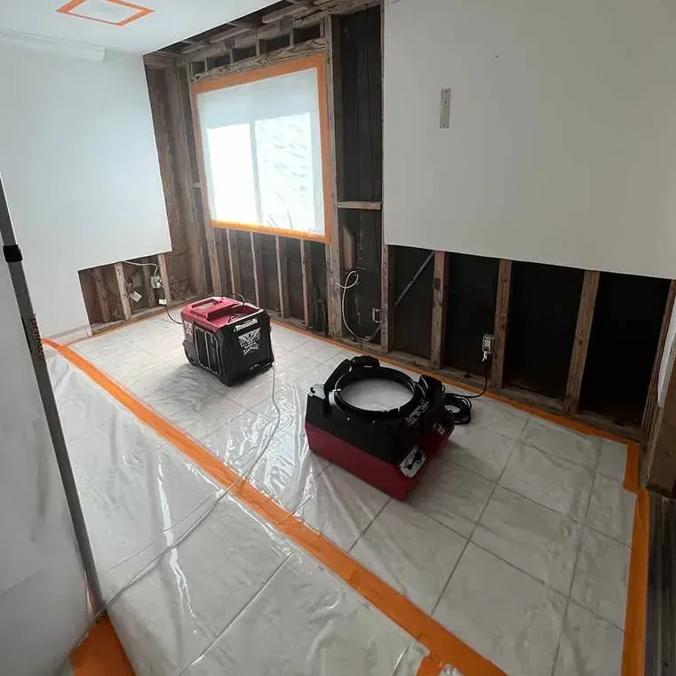 Indoor room drying equipment positioned after a plumbing water release